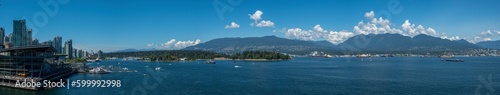 Panorama of Vancouver Harbour including the Trade and Convention Centre with views of Burrard Inlet and North Shore Mountains, BC Canada travel and tourism © Paul Van Buekenhout