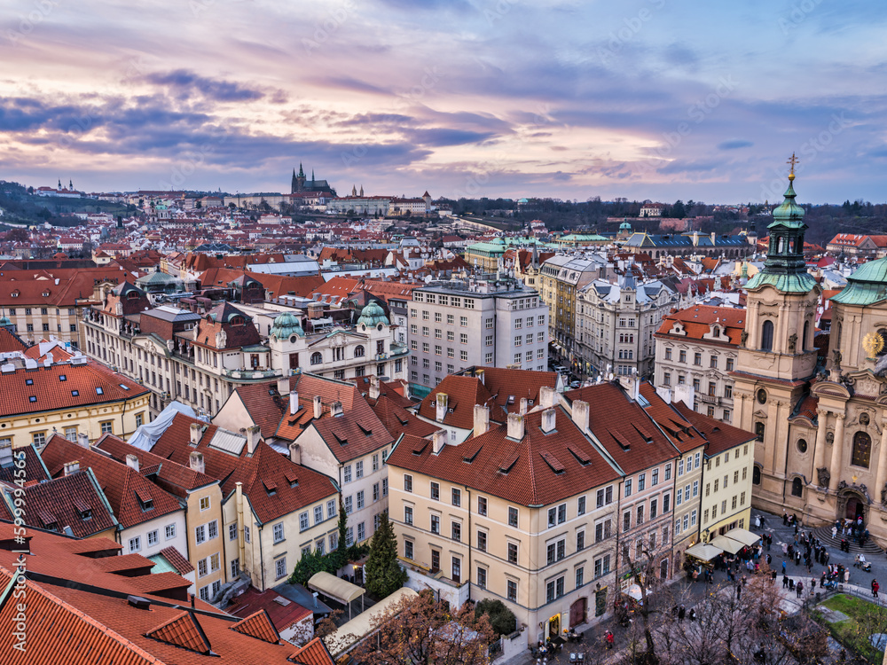 Fototapeta premium Aerial shot of Prague city historic buildings during colorful cloud sunset, Prague, Czech Republic