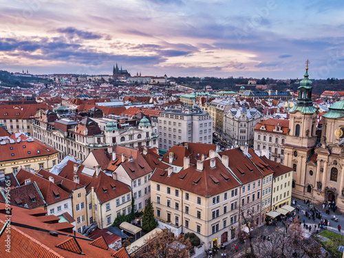 Aerial shot of Prague city historic buildings during colorful cloud sunset, Prague, Czech Republic