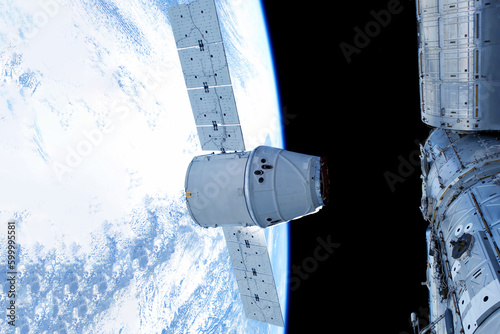 Fototapeta Naklejka Na Ścianę i Meble -  Docking spacecraft in outer space. Elements of this image furnished NASA.
