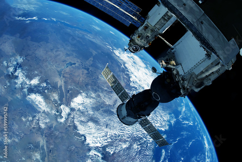 Fototapeta Naklejka Na Ścianę i Meble -  Docking spacecraft in outer space. Elements of this image furnished NASA.