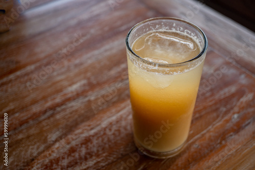 Traditional drink of Indonesia Jamu Beras Kencur Iced, fresh and tasty. The photo is suitable to use for drink background, menu poster and content media.