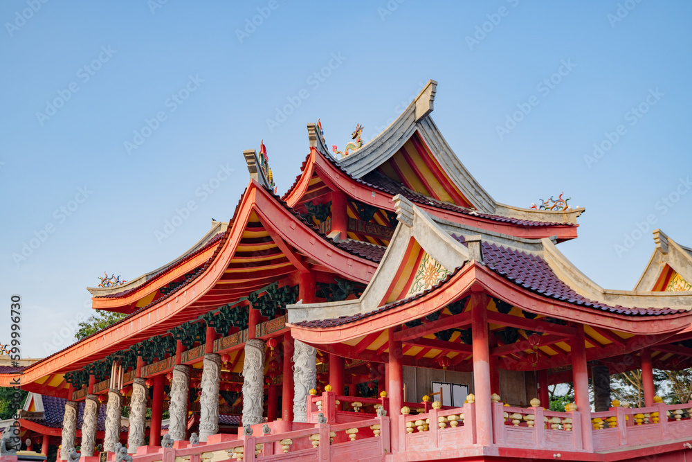 Fototapeta premium Chinese temple with guardian statue when Chinese new year celebration. The photo is suitable to use for Chinese new year, lunar new year background and content media.