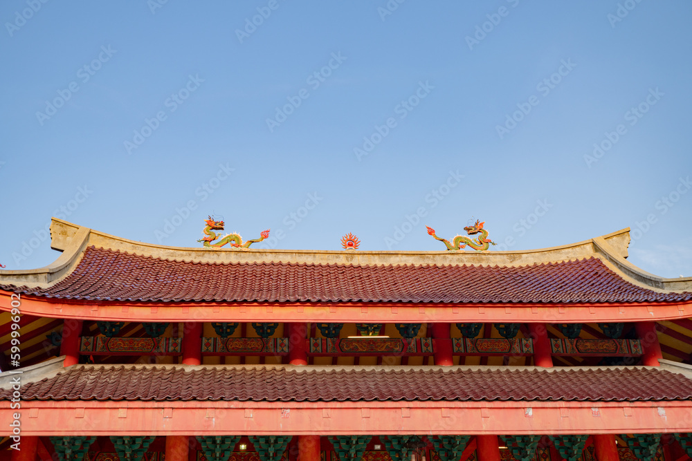 Chinese temple with guardian statue when Chinese new year celebration. The photo is suitable to use for Chinese new year, lunar new year background and content media.