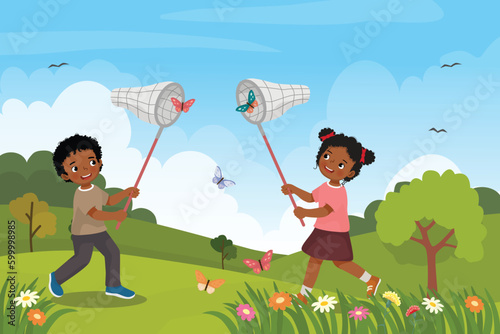 Cute African kids catching butterfly with net at the garden in the spring season