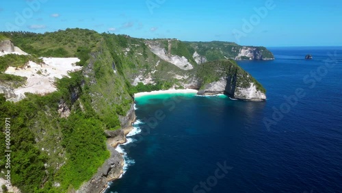 Kelingking beach. Kelingking Beach is the top destiantions on Nusa Penida Island. However visiting Kelingking viewpoint is one of the most famous things to do in Bali.  photo