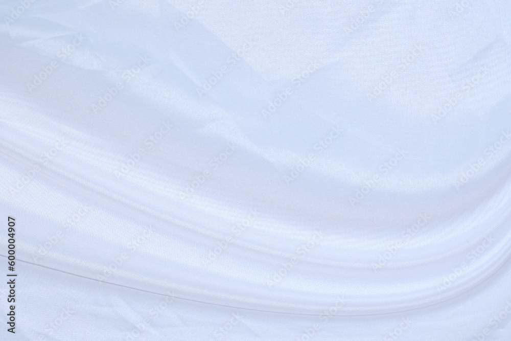 Obraz premium Smooth elegant white silk or satin luxury cloth texture can use as wedding background. Luxurious background design