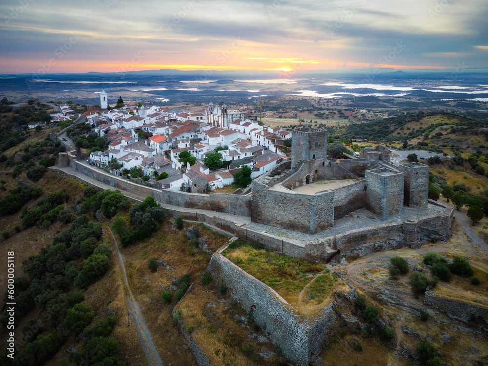 Aerial view of Monsaraz a tiny charming village inside castle walls in Alentejo region of Portugal, at sunrise