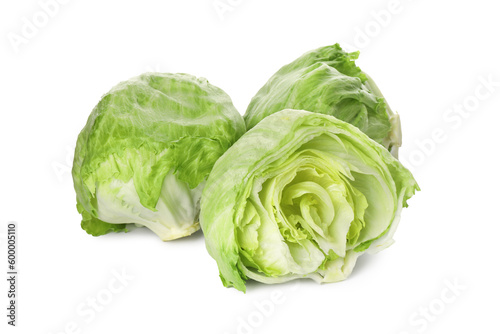 Whole and cut fresh green iceberg lettuces isolated on white