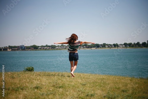 person spinning outdoors holding their arms out