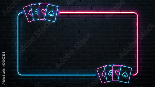Neon frame with pink and blue cards. A poster for a casino against a dark brick wall.