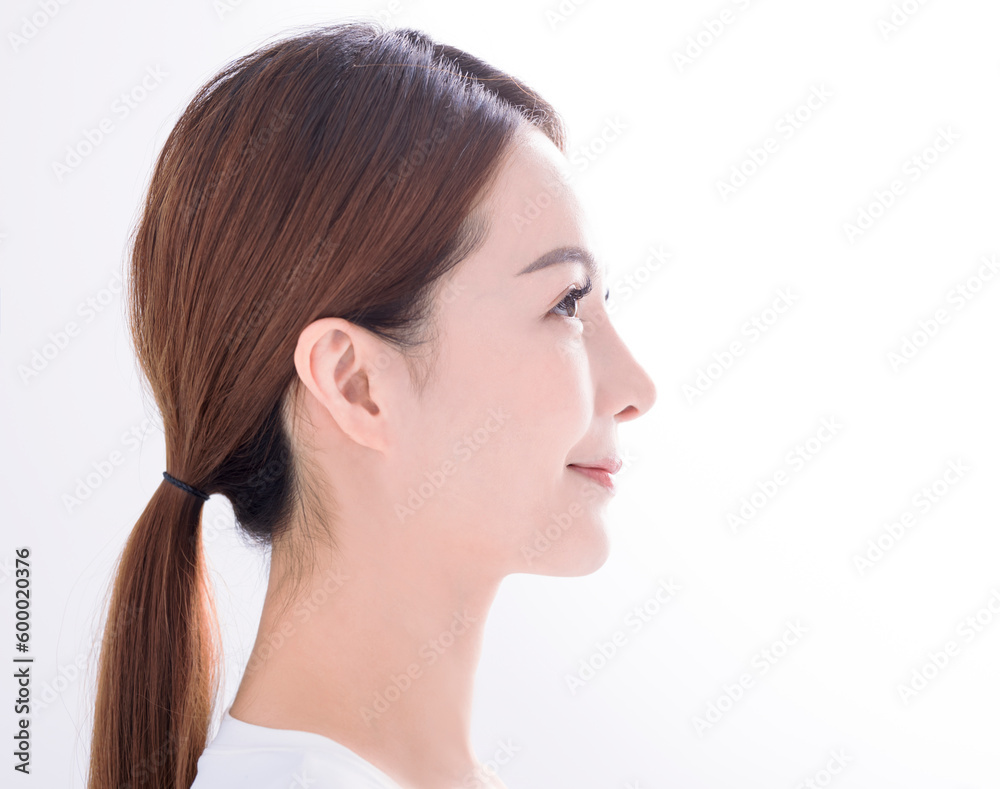 Side view of Beautiful young asian woman with clean fresh skin on white background Side view of Beautiful young asian woman with clean fresh skin on white background