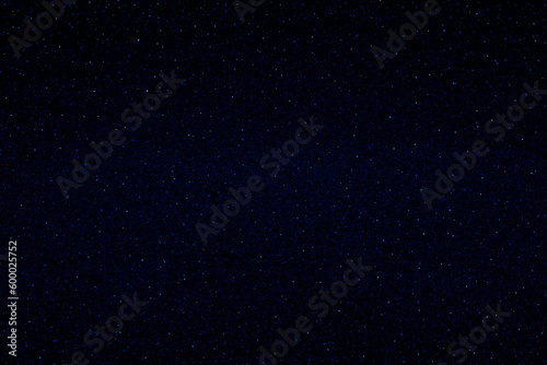 Starry night sky. Glowing stars in the night. Dark blue galaxy space background. 