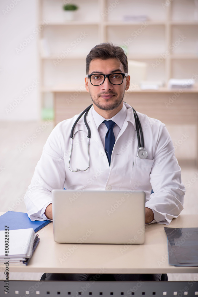 Young male doctor in telemedicine concept Young male doctor in telemedicine concept