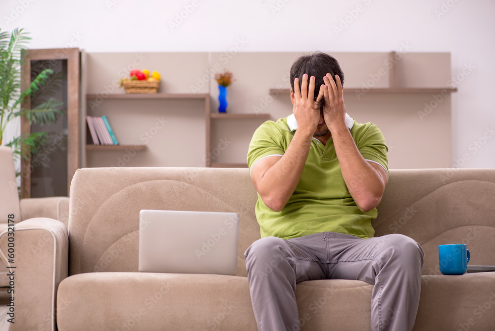 Young male freelancer working from home Young male freelancer working from home