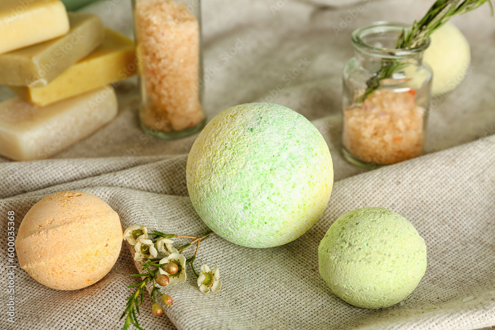 Bath bombs with flowers on cloth, closeup Bath bombs with flowers on cloth, closeup