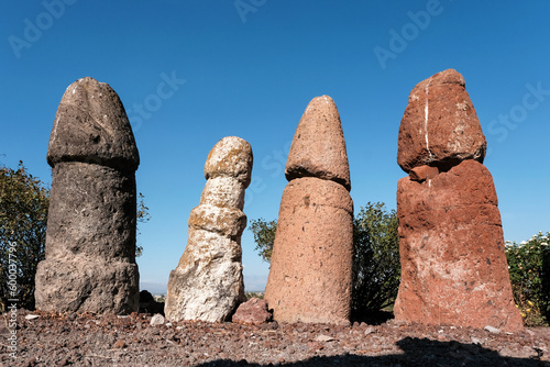 Ancient stone phallic symbols in Metsamor Archeological Site on sunny summer day. Taronik, Armavir Province, Armenia.