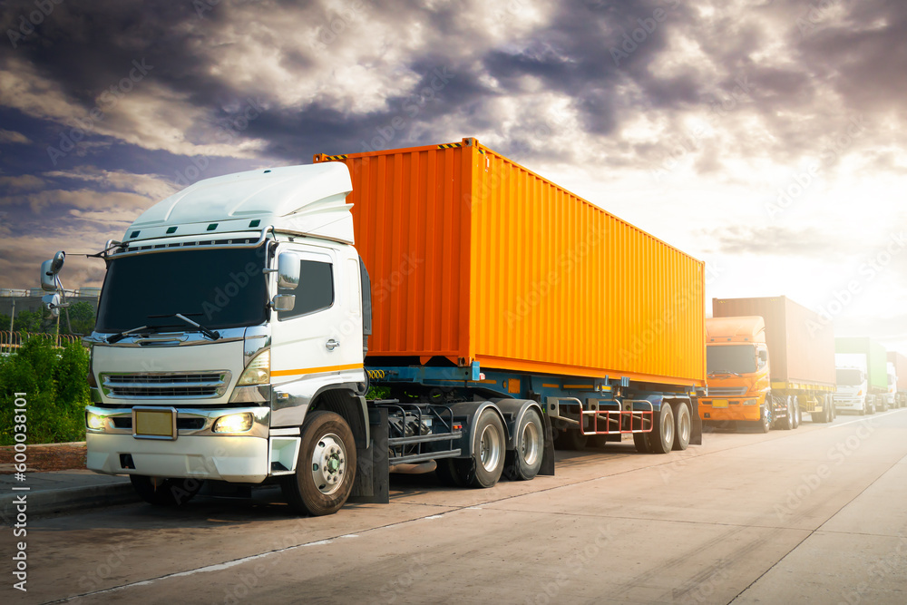 Semi Trailer Trucks on The Road with The Sunset Sky. Shipping Container Trucks. Commercial Truck Transport. Delivery. Diesel Tractor. Freight Trucks Logistics, Cargo Transport. Semi Trailer Trucks on The Road with The Sunset Sky. Shipping Container Trucks. Commercial Truck Transport. Delivery. Diesel Tractor. Freight Trucks Logistics, Cargo Transport.