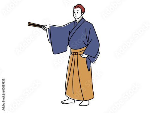 扇子で指し示す袴姿の男性　png