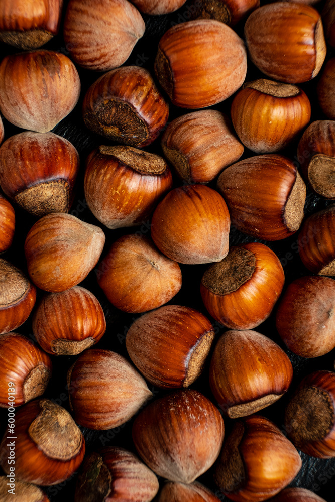 pile of hazelnuts with shells full frame close-up background pile of hazelnuts with shells full frame close-up background