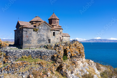 View of medieval Hayravank monastery and Sevan lake on sunny summer day. Gegharkunik Province, Armenia.
