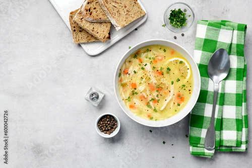 Lemon chicken orzo soup. Healthy food. top view	
