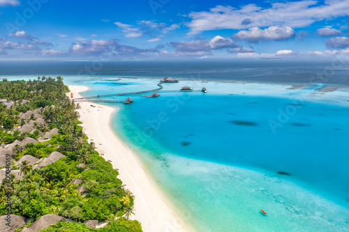 Beautiful Maldives paradise. Tropical aerial travel landscape  seascape with wooden bridge  water villas  amazing sea sand sky beach  tropical island nature. Exotic tourism destination summer vacation