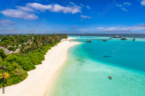 Beautiful Maldives paradise. Tropical aerial travel landscape, seascape with wooden bridge, water villas, amazing sea sand sky beach, tropical island nature. Exotic tourism destination summer vacation