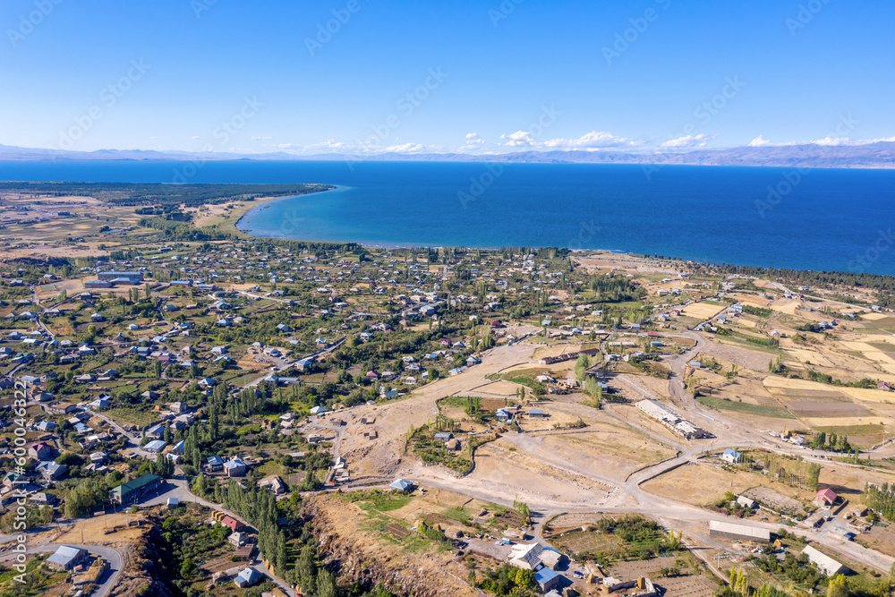 Aerial view of Artsvanist village and Sevan lake on sunny summer day. Gegharkunik Province, Armenia.