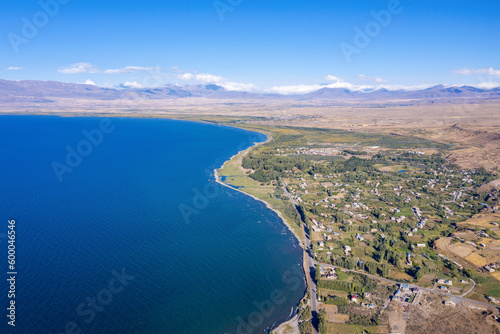 Aerial view of Karchaghbyur village and Sevan lake on sunny summer day. Gegharkunik Province, Armenia.