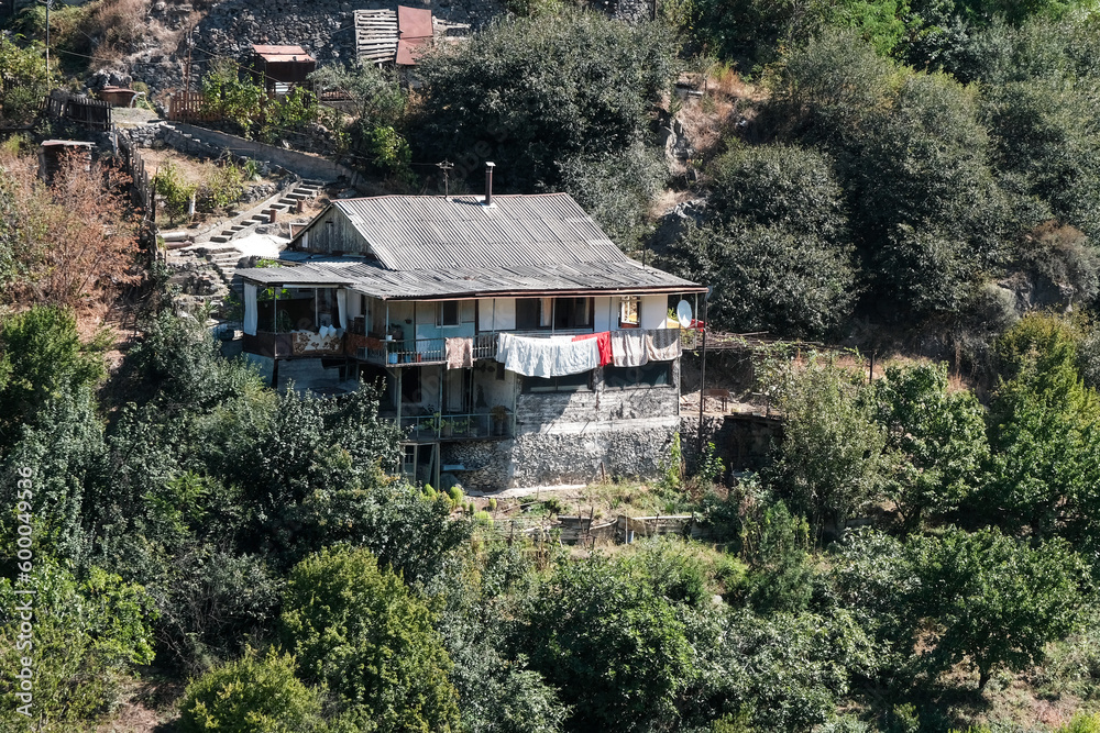 View of traditional Armenian rural house on sunny summer day. Akhtala village, Lori Province, Armenia.