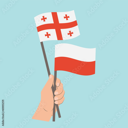 Flags of Georgia and Poland, Hand Holding flags