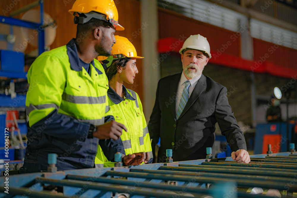 Senior boss manager inspecting with staff engineers woman and African ...