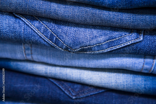 folded blue jeans pant pattern texture can be used as a background wallpaper