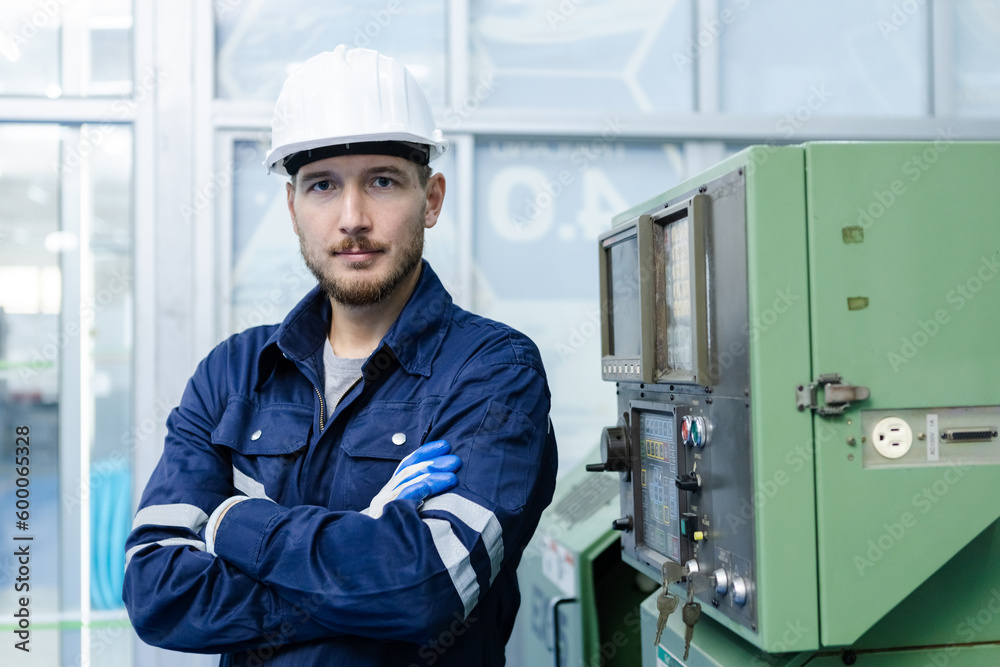 Portrait of happy smiling male engineer workers standing crossed arms in manufacturing factory workplace. professional technician production operator CNC machine at factory. Portrait of happy smiling male engineer workers standing crossed arms in manufacturing factory workplace. professional technician production operator CNC machine at factory.