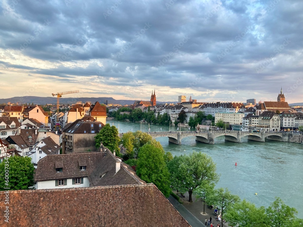 View of Basel and its Cathedral and the river Rhine at sunset	