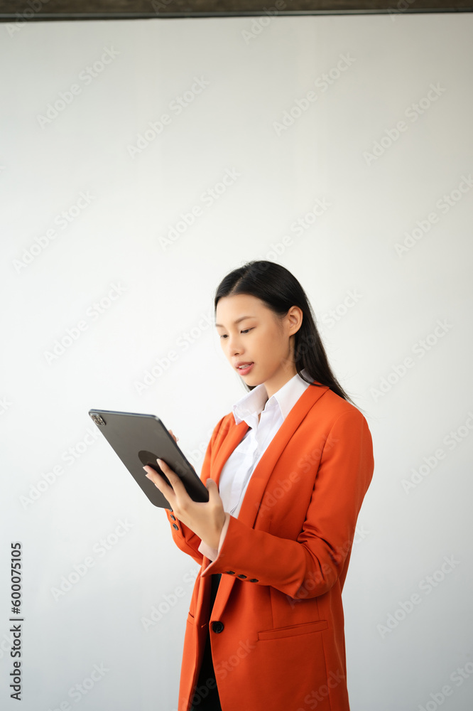 Portrait photo of young beautiful Asian woman feeling happy and holding smart phone, tablet and laptop with black empty screen on white background product presenting concept.. Portrait photo of young beautiful Asian woman feeling happy and holding smart phone, tablet and laptop with black empty screen on white background product presenting concept..