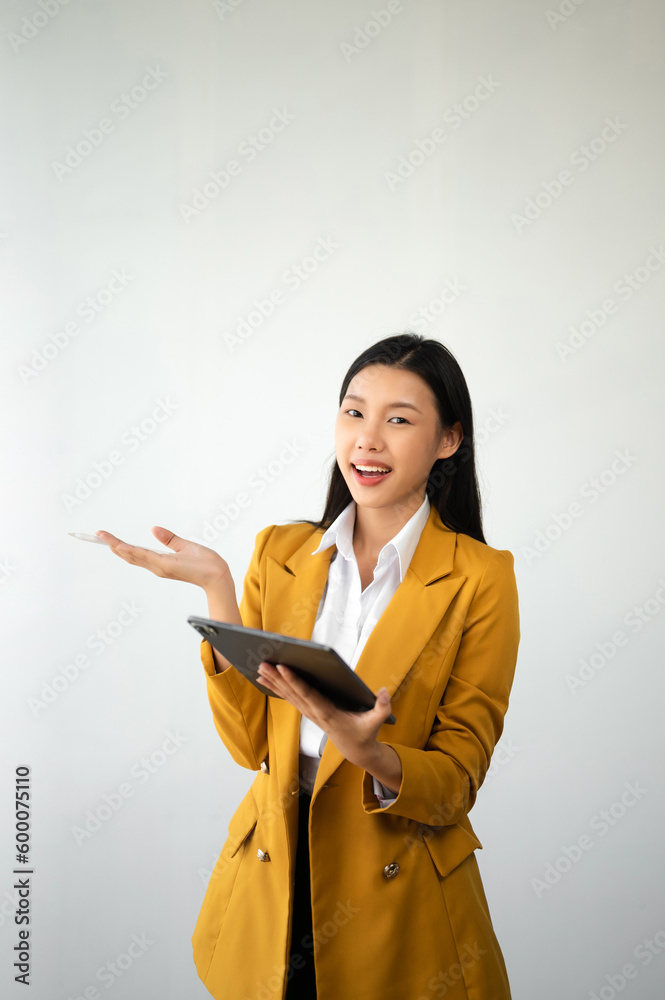 Portrait photo of young beautiful Asian woman feeling happy and holding smart phone, tablet and laptop with black empty screen on white background product presenting concept.. Portrait photo of young beautiful Asian woman feeling happy and holding smart phone, tablet and laptop with black empty screen on white background product presenting concept..