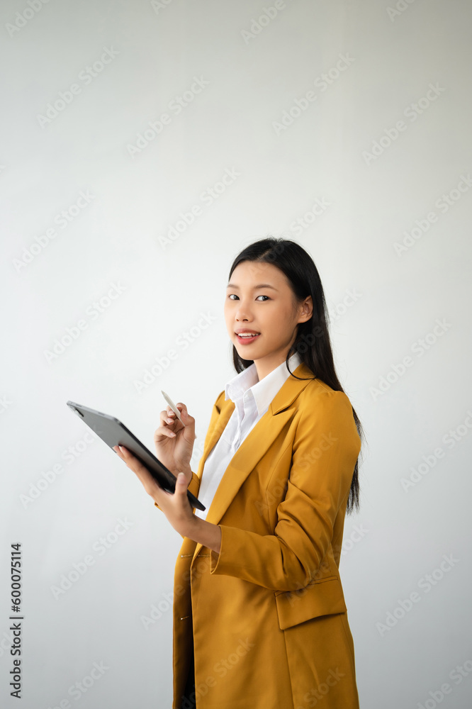 Portrait photo of young beautiful Asian woman feeling happy and holding smart phone, tablet and laptop with black empty screen on white background product presenting concept.. Portrait photo of young beautiful Asian woman feeling happy and holding smart phone, tablet and laptop with black empty screen on white background product presenting concept..