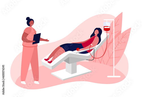 A female volunteer donates blood in a hospital