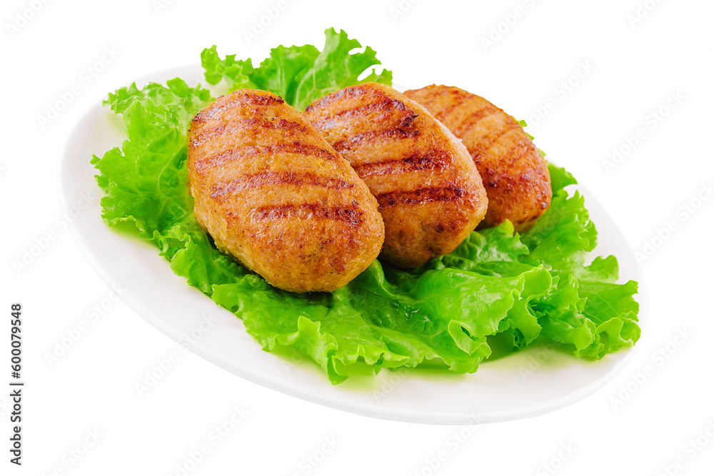 Three cutlets with lettuce on a plate isolated