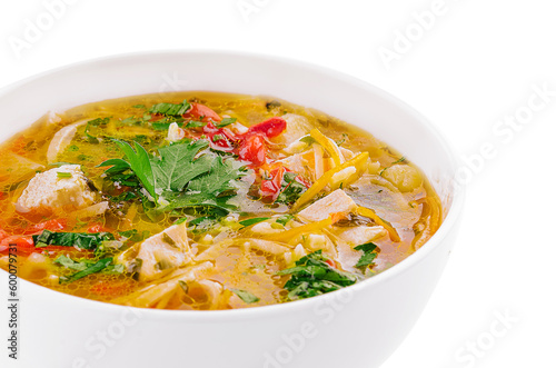 chicken noodle soup in a white ceramic bowl isolated on white