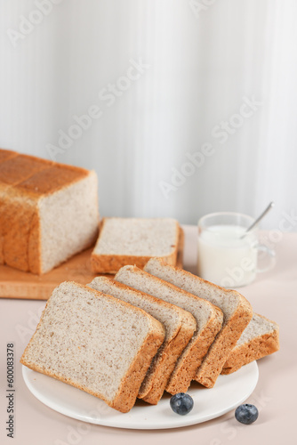 Scene with toast bread with fruit and milk, healthy breakfast, indoor kitchen photography