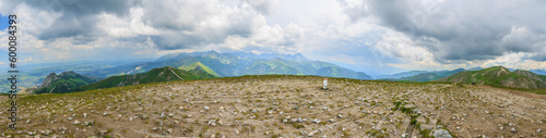 Panorama of the Tatra Mountains: Krzesanica and Ciemniak (right), Giewont and Kopa Kondracka (left), High Tatras (in the distance) from the summit of Małołączniak in the Western Tatras (Poland).