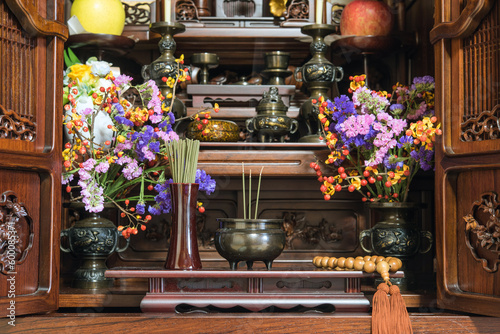 日本のお仏壇　仏花と数珠と線香の煙　Incense burner on Butsudan (household Buddhist altar) in Japanese house photo