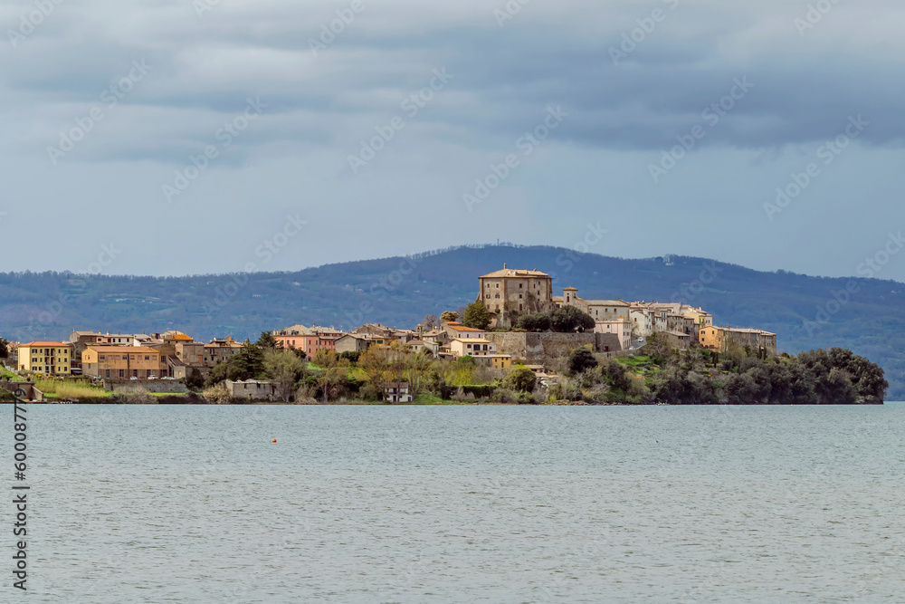 The promontory on Lake Bolsena on which Capodimonte is located, Italy, under a dramatic sky