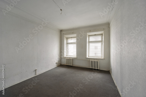 Empty room without furniture in an old apartment building. Unrenovated empty room