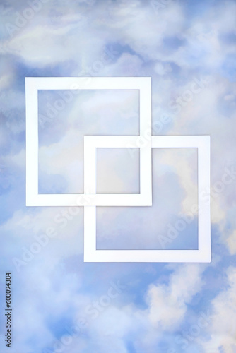 Abstract blue sky cloud background border with two square white frames. Minimal geometric nature weather creative concept. Flat lay.