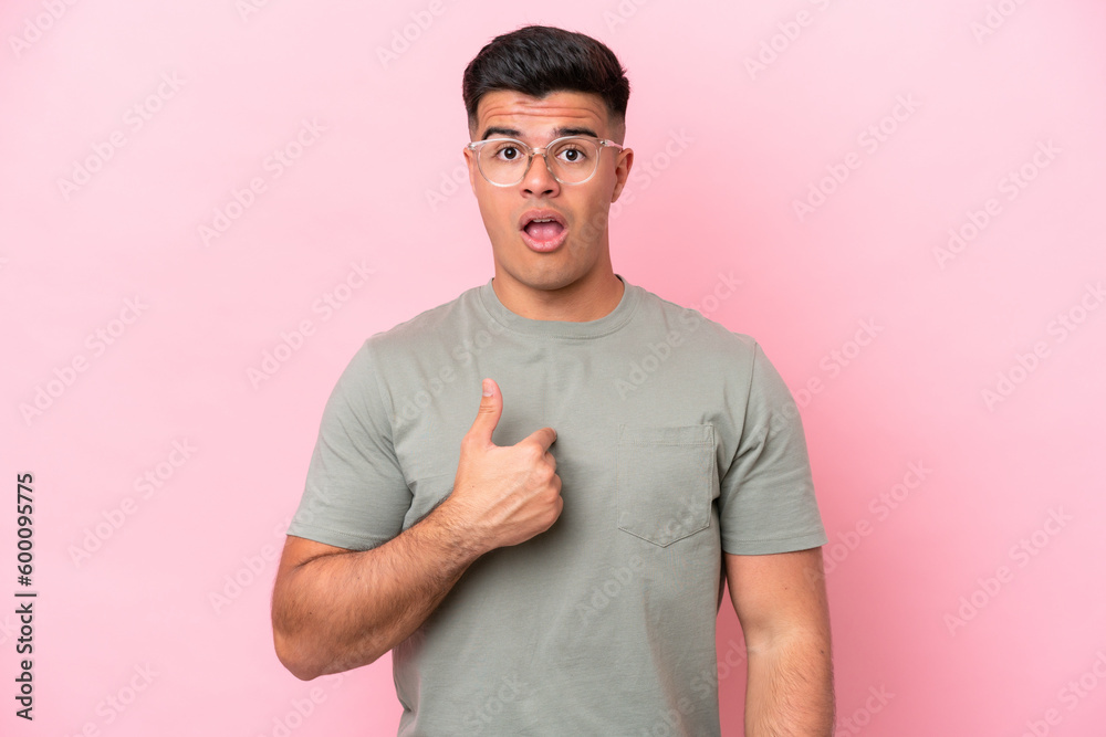 Young caucasian handsome man isolated on pink background pointing to oneself Young caucasian handsome man isolated on pink background pointing to oneself