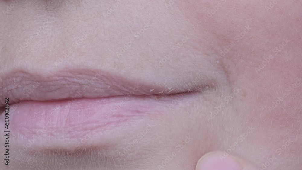 close up part of mature female face, woman 50-55 years old looks carefully examines wrinkles around lips, skin folds, age-related changes, aesthetic injection cosmetology, care anti-aging procedures close up part of mature female face, woman 50-55 years old looks carefully examines wrinkles around lips, skin folds, age-related changes, aesthetic injection cosmetology, care anti-aging procedures